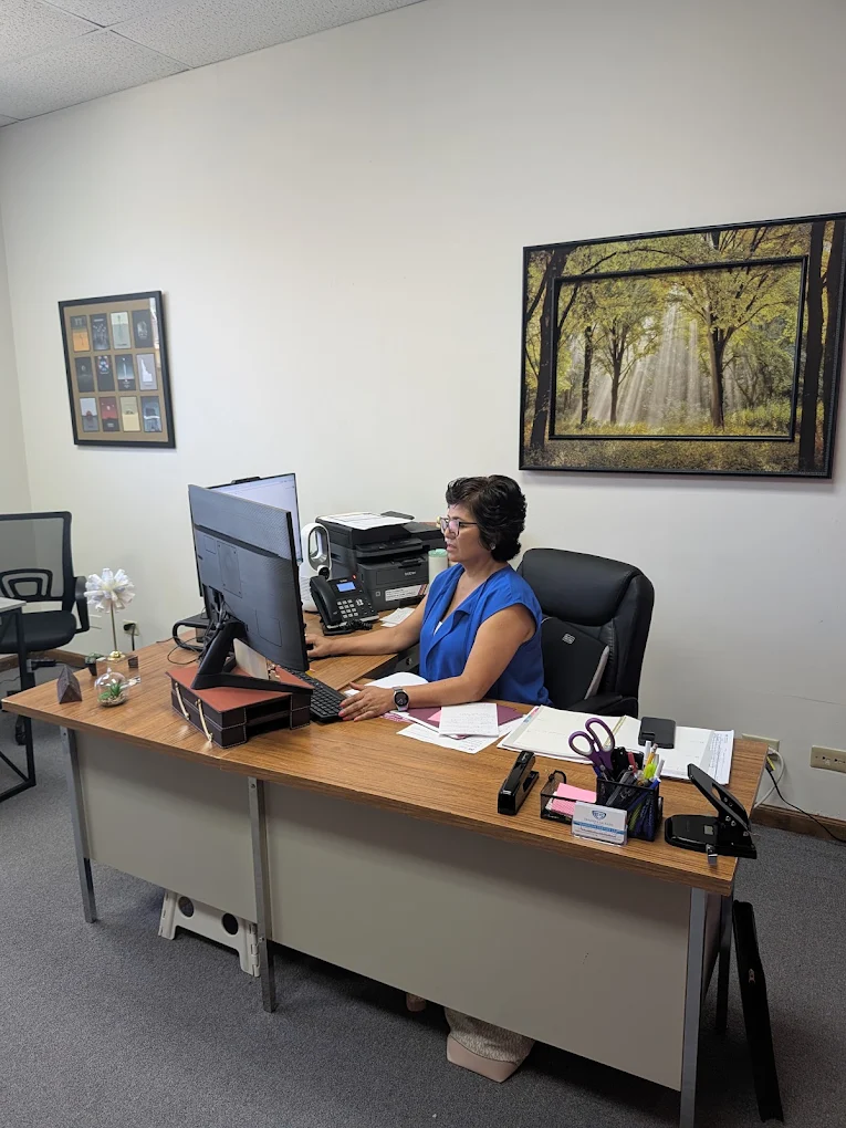 Team member working at the front desk inside the European Service home care office in Elgin, Illinois.